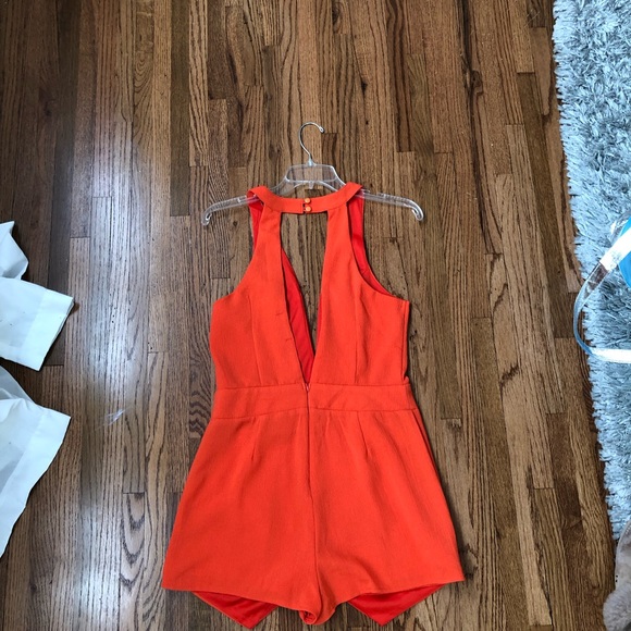 An orange romper - Picture 2 of 4